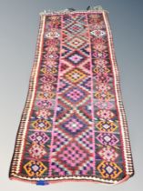 An Afghan fringed runner 260 cm x 105 cm