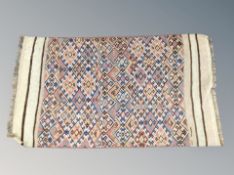 An Afghan flatweave rug 145 cm x 82 cm
