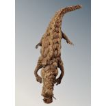 A folk art crocodile made from knotted rope length 46 cm