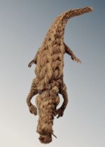 A folk art crocodile made from knotted rope length 46 cm