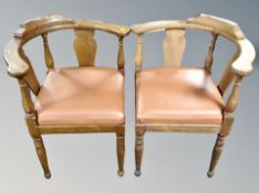 A pair of oak corner armchairs