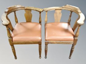 A pair of oak corner armchairs