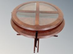 A contemporary circular coffee table with four nesting tables