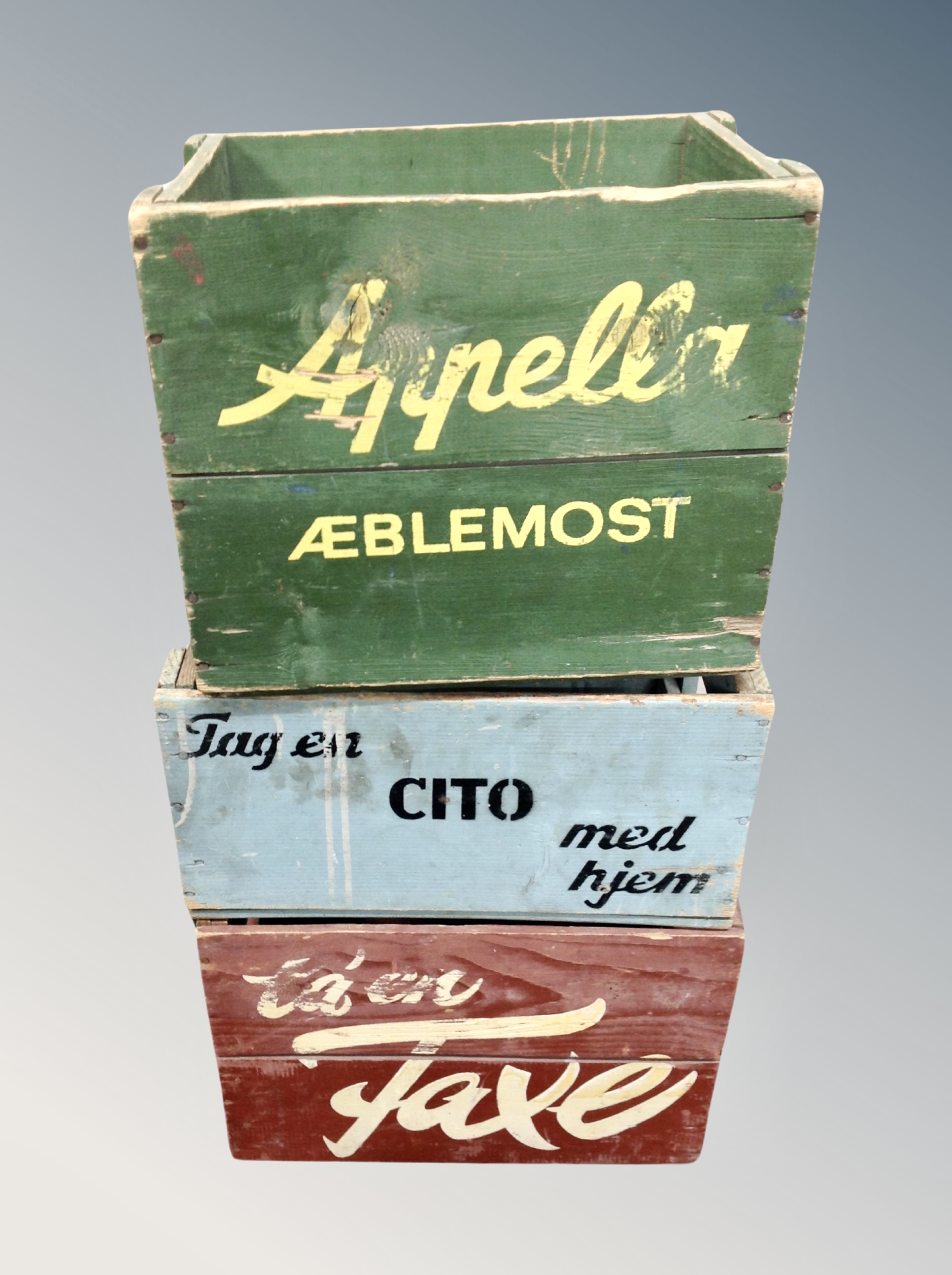 Three Danish pine crates bearing advertising