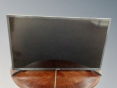 A Samsung 32 inch LCD TV with remote