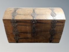 A 19th century oak and wrought iron mounted domed shipping trunk,