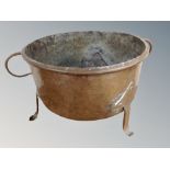 A 19th century copper twin handled cooking pot,