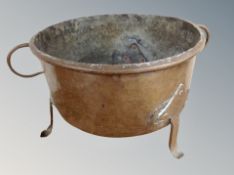 A 19th century copper twin handled cooking pot,