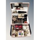 A contemporary lift out jewellery chest containing costume jewellery, faux pearls, compact,