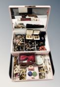 A contemporary lift out jewellery chest containing costume jewellery, faux pearls, compact,