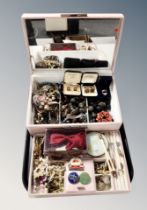A contemporary lift out jewellery chest containing costume jewellery, faux pearls, compact,