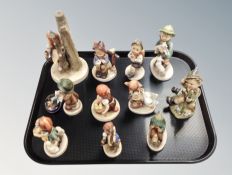 Eleven Goebel figures and a German enamelled tin