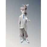 A Lladro figure of a golfer