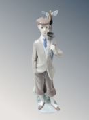 A Lladro figure of a golfer