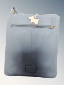 A Lady's blue leather Radley hand bag with dust cover together with a further Kipling and Calvin