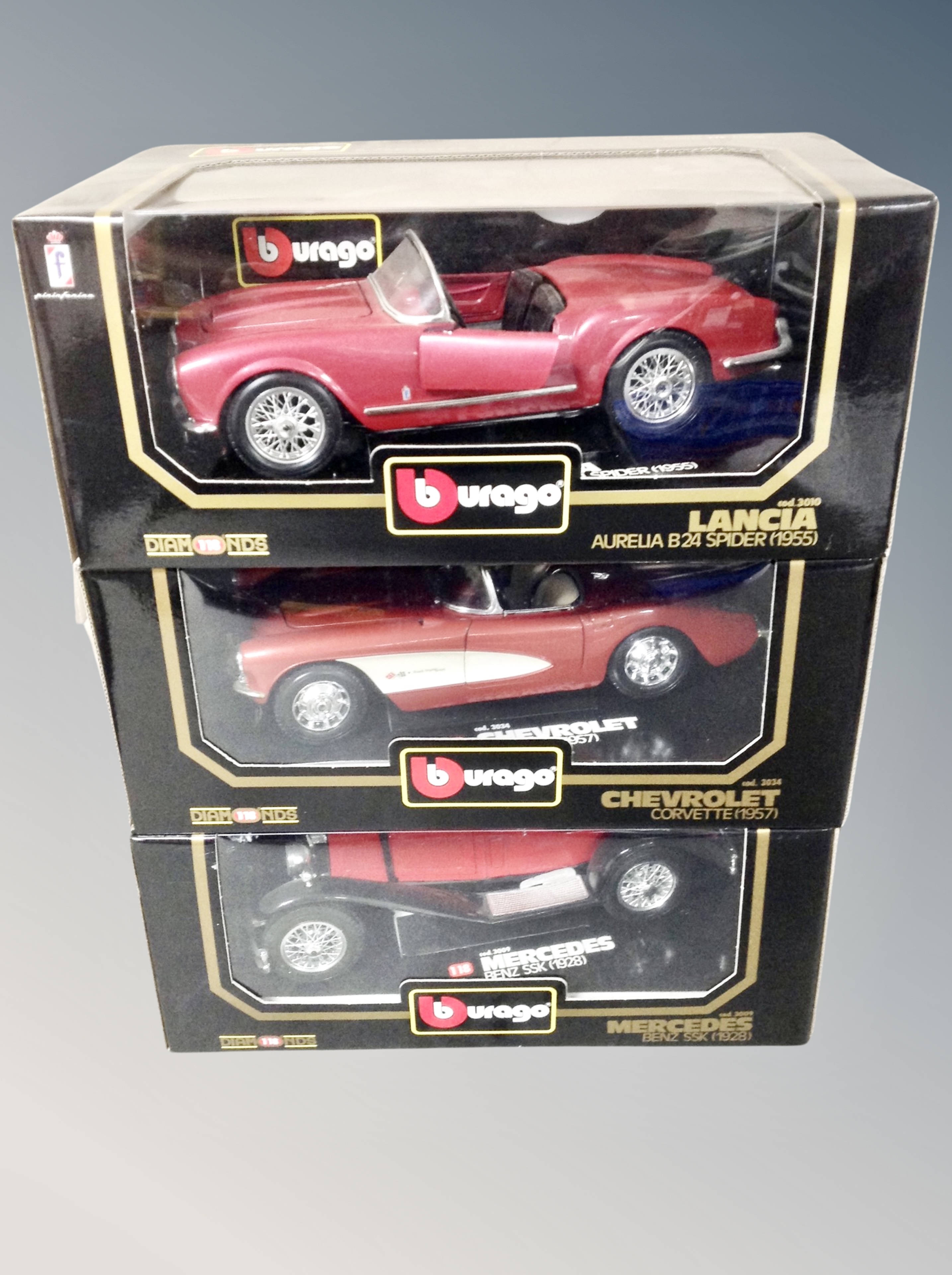 Three boxed Burago die cast vehicles 1/18 scale -Lancier Auralia B24 Spider,