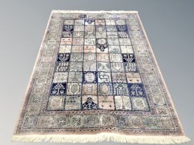 A Ghom design rug 240 cm x 149 cm