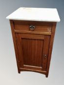 A marble topped pot cupboard,