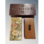 A carved oak bridge box with contents, box of old chequers,