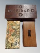 A carved oak bridge box with contents, box of old chequers,