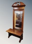 A 19th century walnut console table with mirror above,