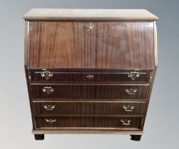 A reproduction mahogany writing bureau,