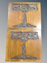 A pair of Art Nouveau carved oak panels,