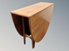 A teak drop leaf dining table