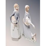 A Lladro figure of a lady carrying a goose,