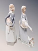 A Lladro figure of a lady carrying a goose,