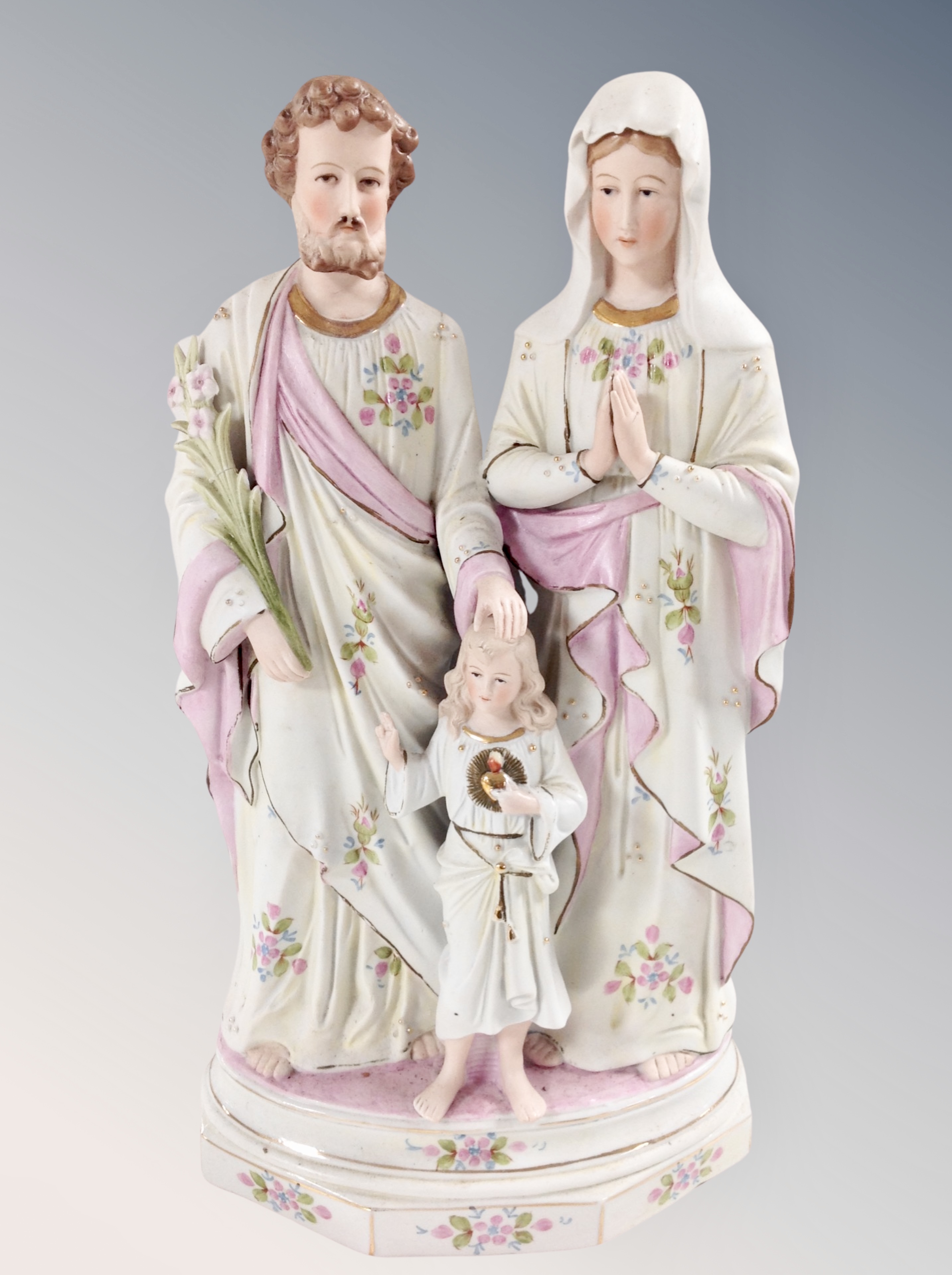 A bisque porcelain religious figure group,