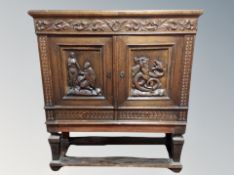 A Continental carved oak court cupboard,