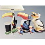 Two Guinness Toucan money boxes, similar pair of salt and pepper sifters,