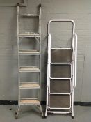 An aluminium step ladder and four tread folding ladder