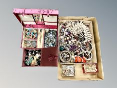 A box of assorted costume jewellery, shell fringed necklace, beads,