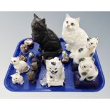A tray of ceramic cat ornaments, pair of metal owl sifters,