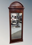 A 19th century inlaid mahogany arch topped mirror,
