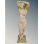 A sandstone figure of a nude female,