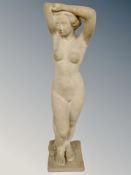 A sandstone figure of a nude female,