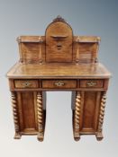 A 19th century walnut and ebonised writing desk fitted with three drawers width 100 cm