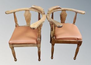 A pair of oak corner chairs