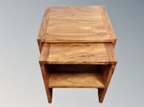 A nest of two mango wood tables