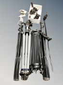 A group of camera tripods,