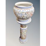 A faience pottery jardiniere on stand,