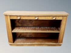 A Danish walnut open low bookcase fitted with three drawers,