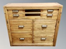 A contemporary oak secretaire chest fitted with six drawers,
