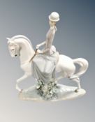 A Lladro figure of a lady on horseback,