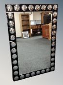 A contemporary two tone all glass mirror,