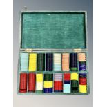 A set of early Twentieth Century gaming counters, in varying colours and shapes,