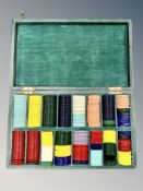 A set of early Twentieth Century gaming counters, in varying colours and shapes,